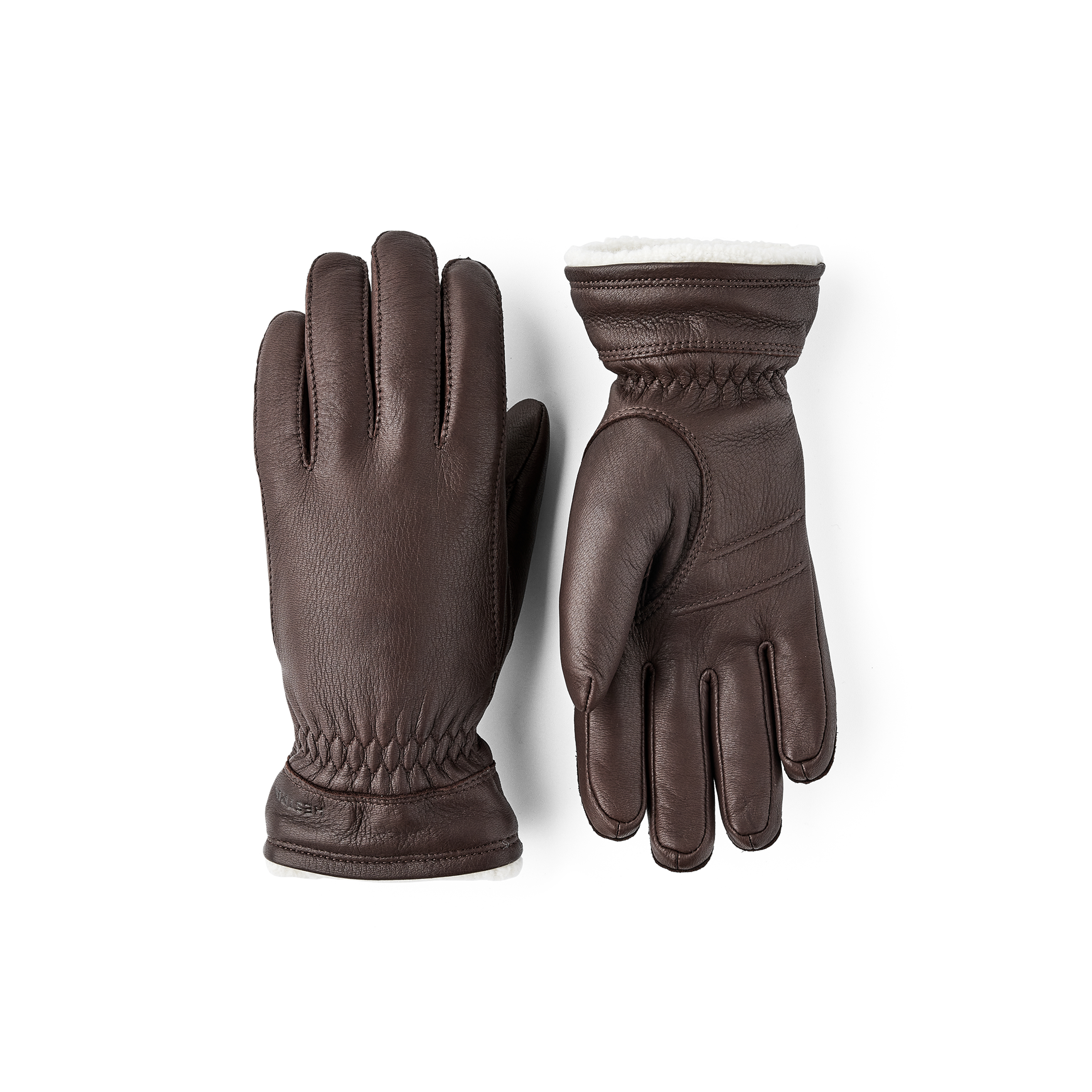 Brown machine-sewn deerskin glove with white trim